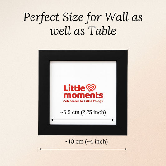 Black color photo frame with 'Little Moments' logo on a beige background