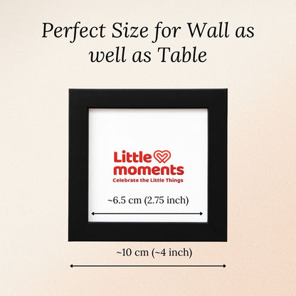 Black color photo frame with 'Little Moments' logo on a beige background