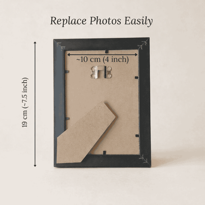 Black picture frame with dimensions on a beige background