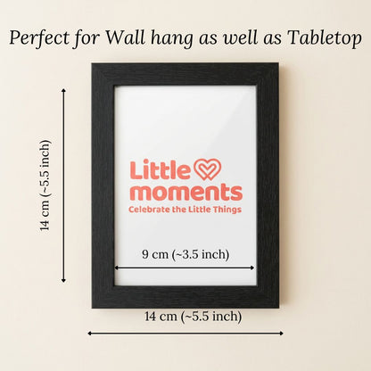 Black photo frame 'Little moments' logo, dimensions indicated on a beige background