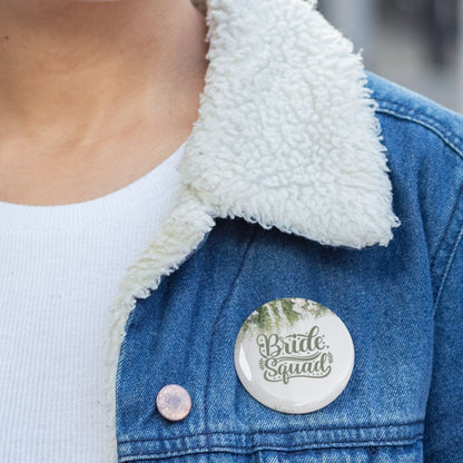 Person wearing a denim jacket with a 'Bride Squad' button badge.