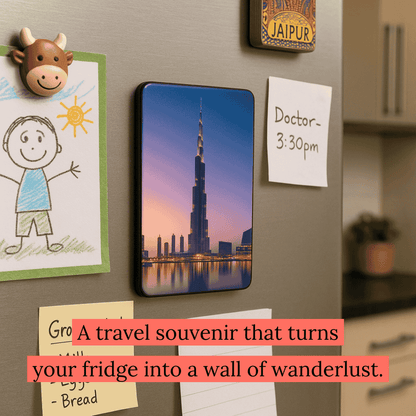 Burj Khalifa fridge magnet attached to a refrigerator along with notes