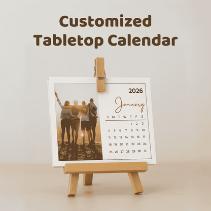 Customized tabletop calendar with a photo of four people on a stand.