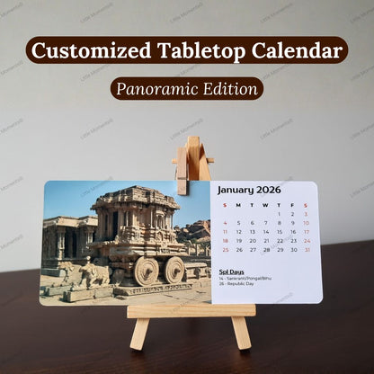 Customized tabletop calendar with landscape photos, placed on a table with wooden easel stand