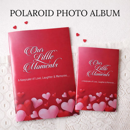 Red colored Polaroid photo album with 'Our Little Moments' text and heart designs on a white lace background.